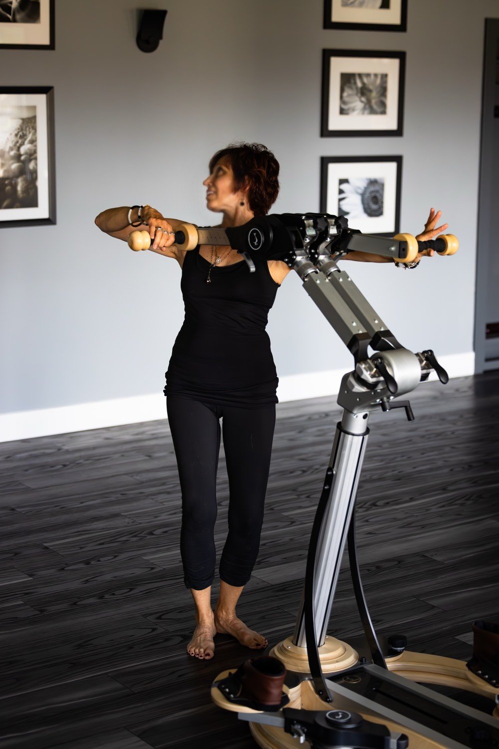 Deborah McBride working the handle units on GYROTONIC equipment at bodySpan Studio